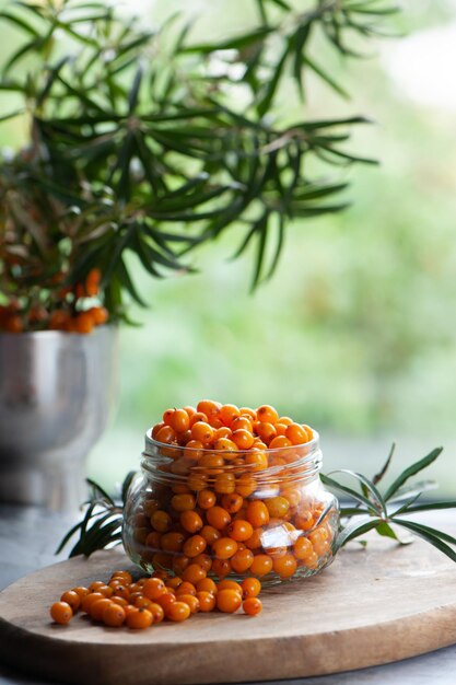 Sea buckthorn berries in a jar orange healthy berries macro