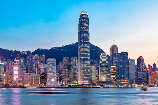 sea by illuminated buildings in city