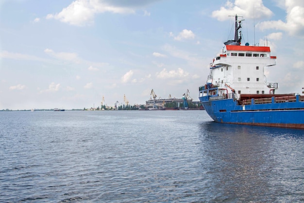 Sea cargo ship enters the port for unloading