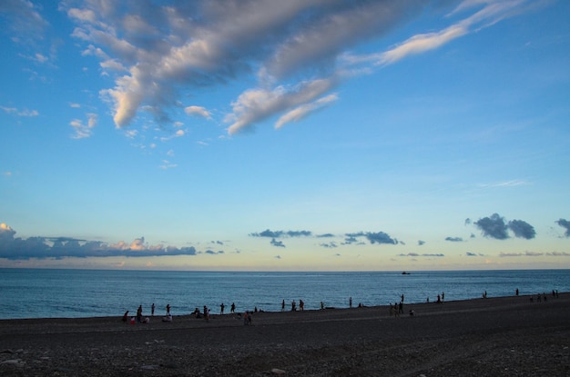 The sea has a sea level blue sky and white clouds