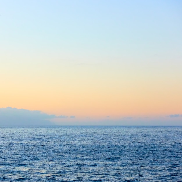 Sea horizon with almost clear sky, may be used as background