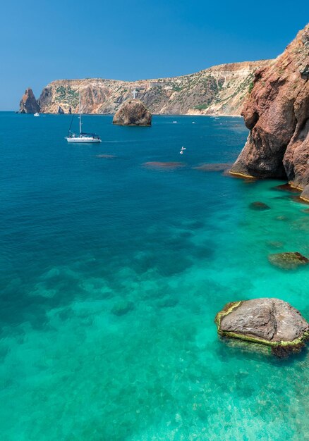 Sea kayaking near the mountain coast on fiolent