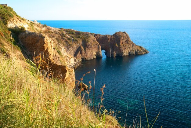 Sea landscape with grotto in the rock