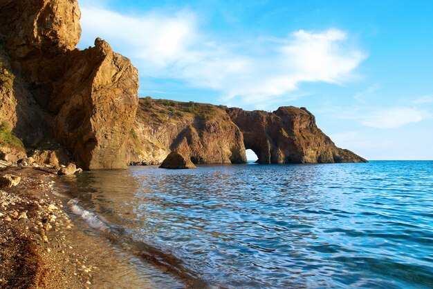 Sea landscape with grotto in the rock