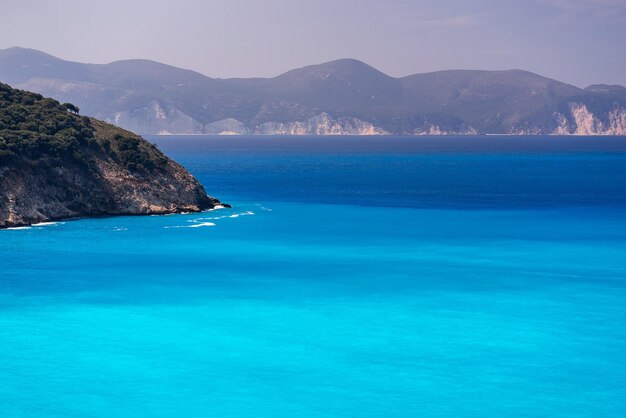 sea landscape with the hilly coast on the horizon and big open space for a natural background