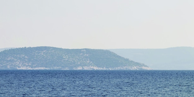 Sea and mountain range. Summer seascape horizon.