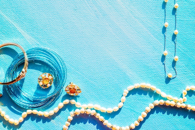 Sea natural jewellery frame on a blue background