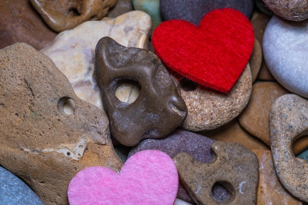 Sea pebbles with holes in the assortment.