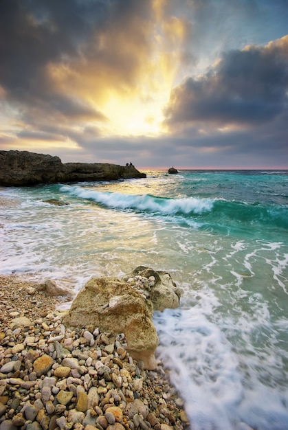 Sea and rock at the sunset.