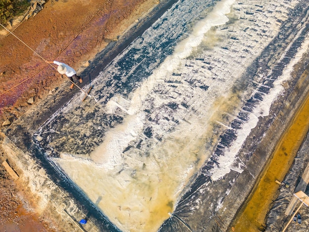 Sea salt process made from pile of salt in the salt pan by salt worker at rural area of Long Dien Ba Ria Vung Tau Salt fields is one of the most unique destinations in Viet Nam