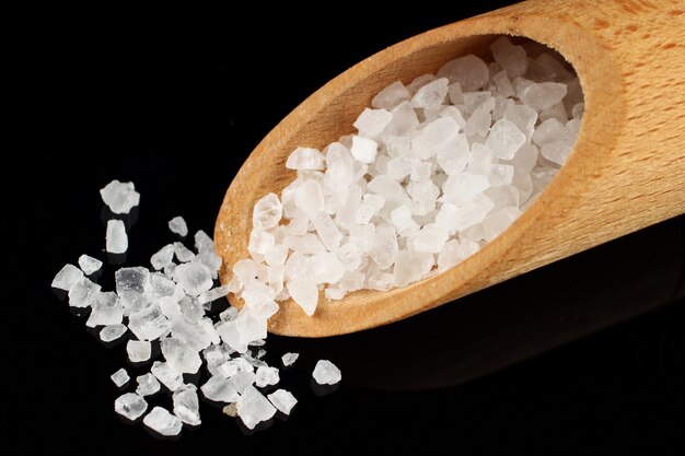 Sea salt in a shovel close up