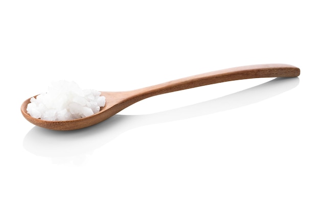 Sea salt on wooden spoon isolated on white