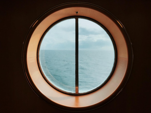 Photo sea seen through window of boat