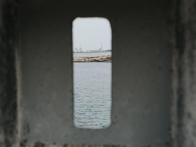 Sea seen through window of building