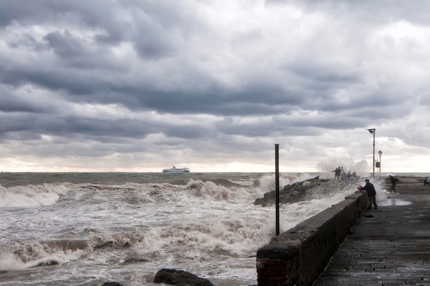 Sea Storm on the shore in a cloudy sky background