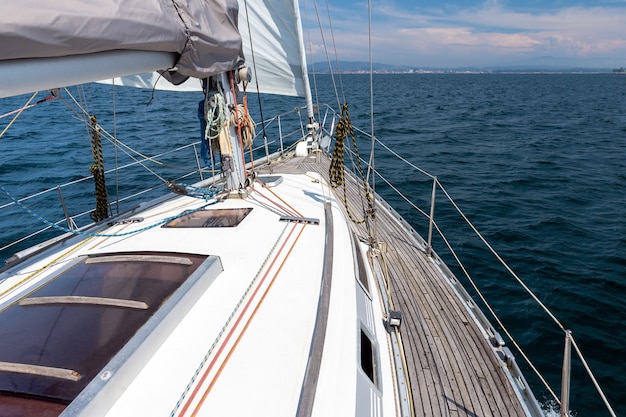 Sea view from the deck of a white sailing yacht