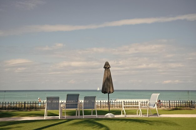 Sea view in Palm Beach Florida USA Beach umbrella and lounge chairs Seaside holidays Summer vacation