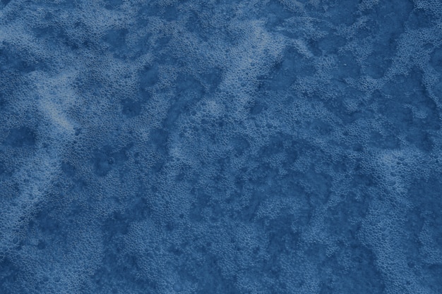 Photo sea water with foam. color of the year 2020