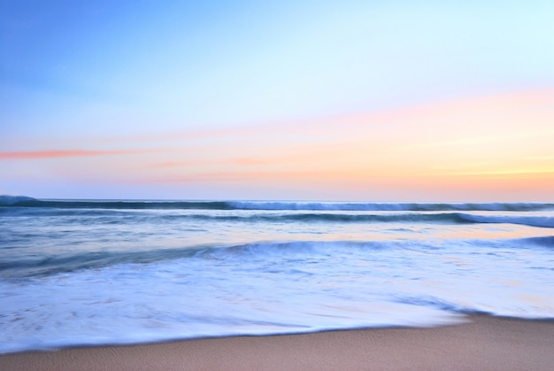  sea wave on the beach at sunset time