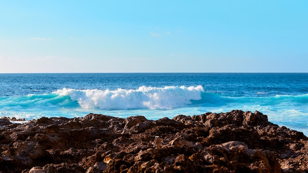 Sea waves on the coast of island.