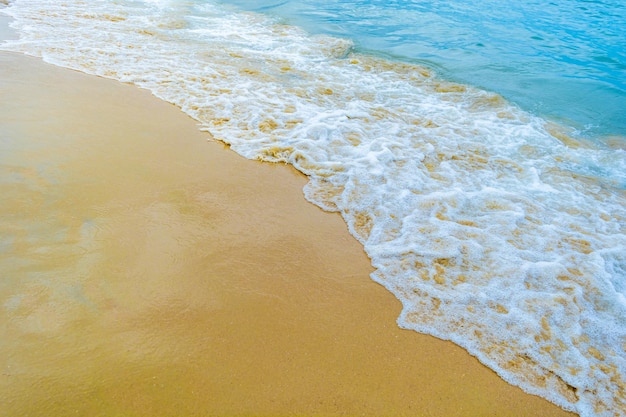 Sea waves coming over the beach sand