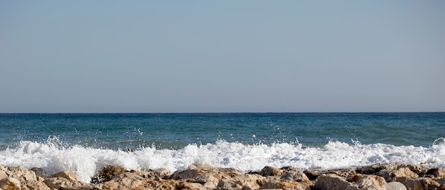 Sea waves crashing against the rocks