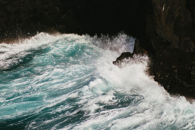 Sea waves splashing on rocks