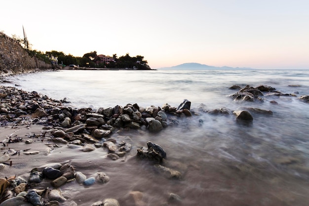 Sea waves on stone beach