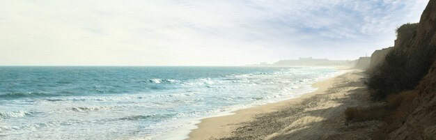 Sea with waves on beautiful sandy beach