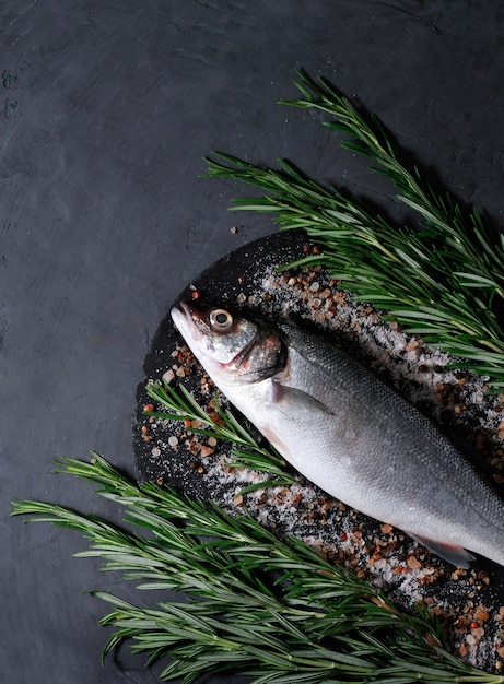 seabass, raw, fresh fish on the board