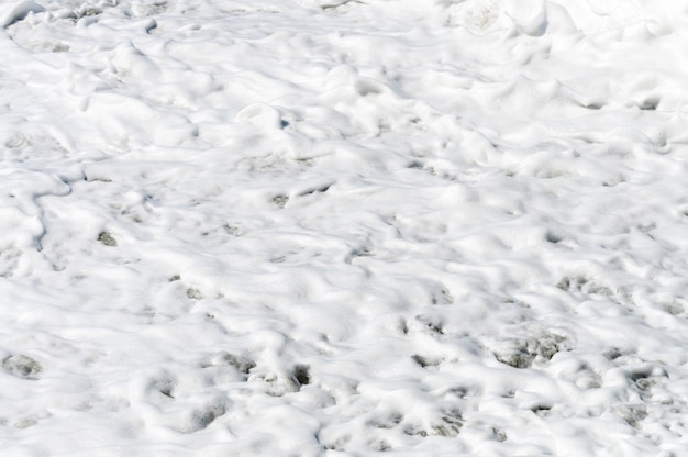 Seafoam formed from the waves