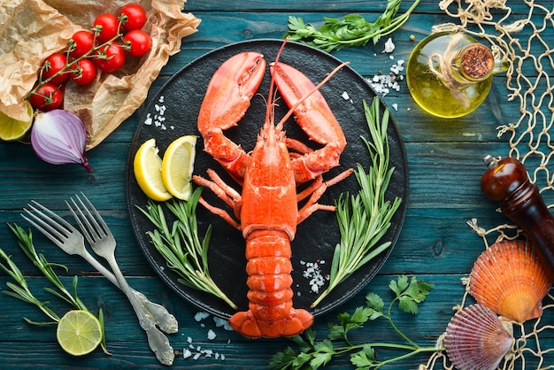 Seafood on a blue background Lobster Top view Free copy space