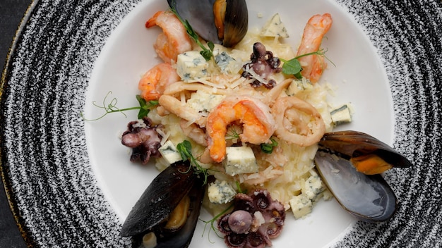 Seafood and cheese risotto with shellfish medley