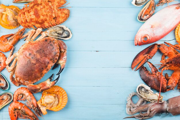 Seafood dinner, seafood dinner with fresh lobster, crab, mussel and oyster as background