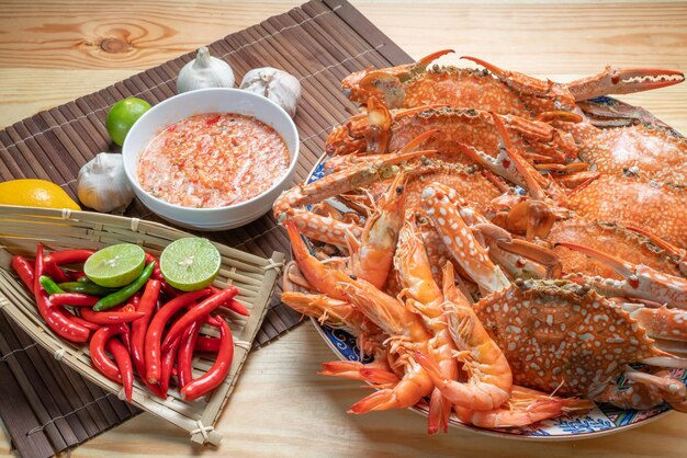 Seafood dish steamed and cooked blue crab served with Thai spicy and sour seafood dipping sauce