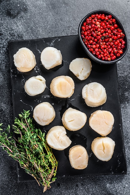 Seafood fresh scallops meat on a marble board