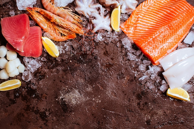 Seafood on the ice, border top view with empty space for text