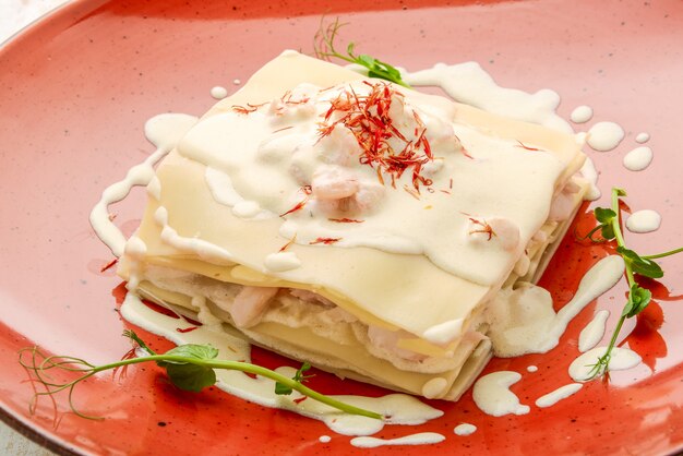 Seafood lasagna with salmon and white sauce