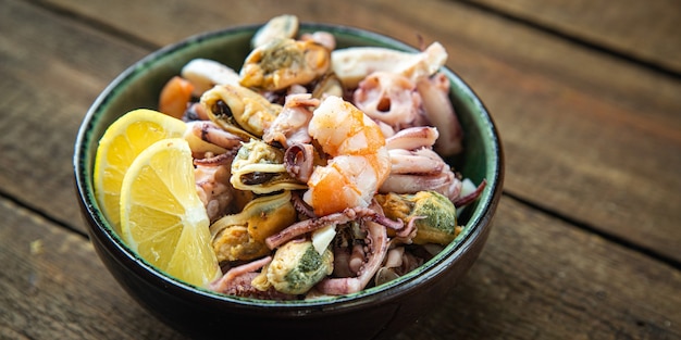 Seafood mix shrimp squid mussel octopus ready to eat meal snack on the table copy space food