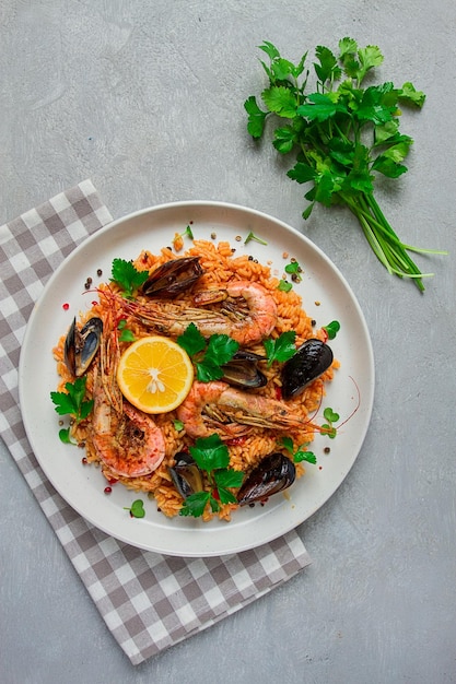 Seafood paella shrimp and mussels risotto rice homemade top view no people