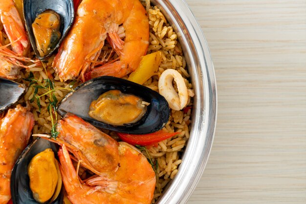 Seafood Paella with prawns, clams, mussels on saffron rice - Spanish food style