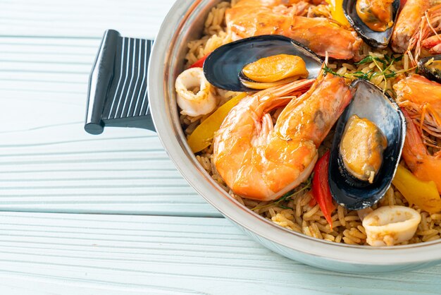 Seafood Paella with prawns, clams, mussels on saffron rice - Spanish food style