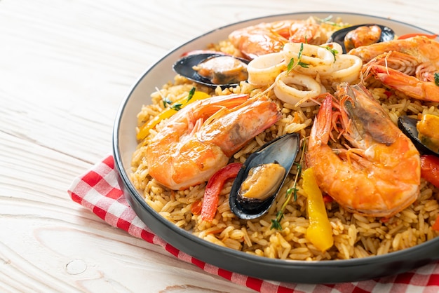 Seafood Paella with prawns, clams, mussels on saffron rice - Spanish food style