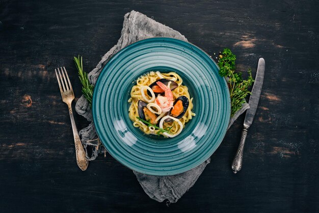 Seafood Pasta On a wooden background Italian cuisine Top view Copy space