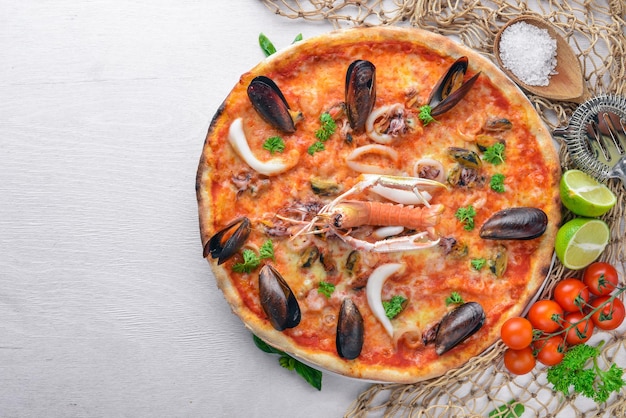 Seafood Pizza Shrimp mussels seafood On a wooden background Top view Free space for your text