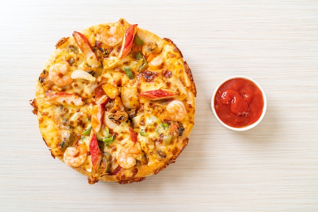 seafood pizza on wood tray