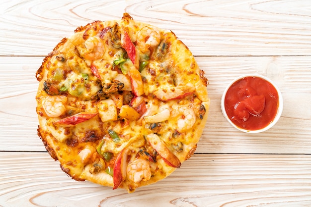 seafood pizza on wood tray