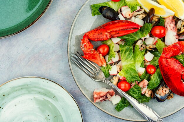 Seafood salad on a plate copy space