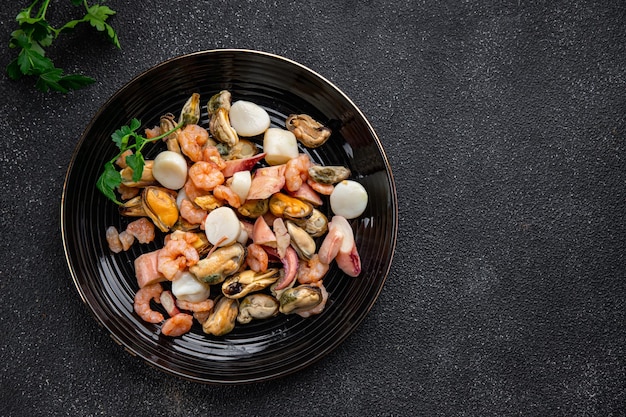 seafood salad shrimp, mussel, scallop, octopus healthy meal food snack on the table copy space