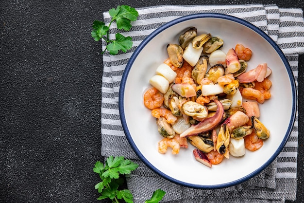 seafood salad shrimp mussel scallop octopus healthy meal food snack on the table copy space